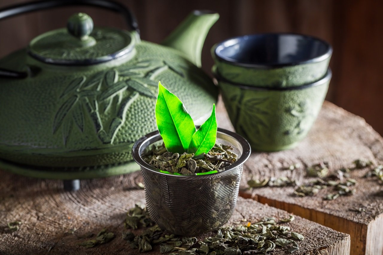 aromatic green tea with iron teapot and cup 2023 11 27 05 30 04 utc