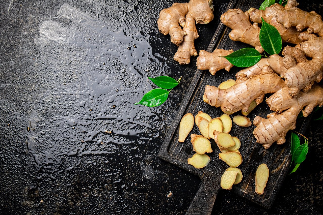 whole and chopped ginger on a cutting board 2024 09 18 00 28 02 utc